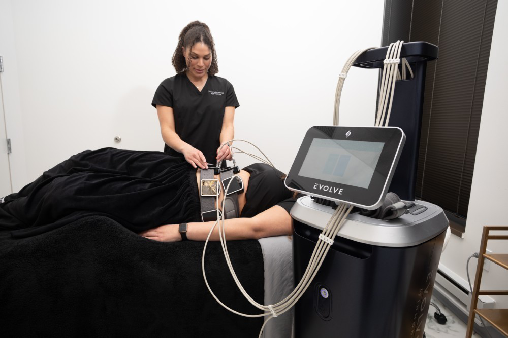 A patient undergoing a non-invasive body contouring treatment using advanced technology.