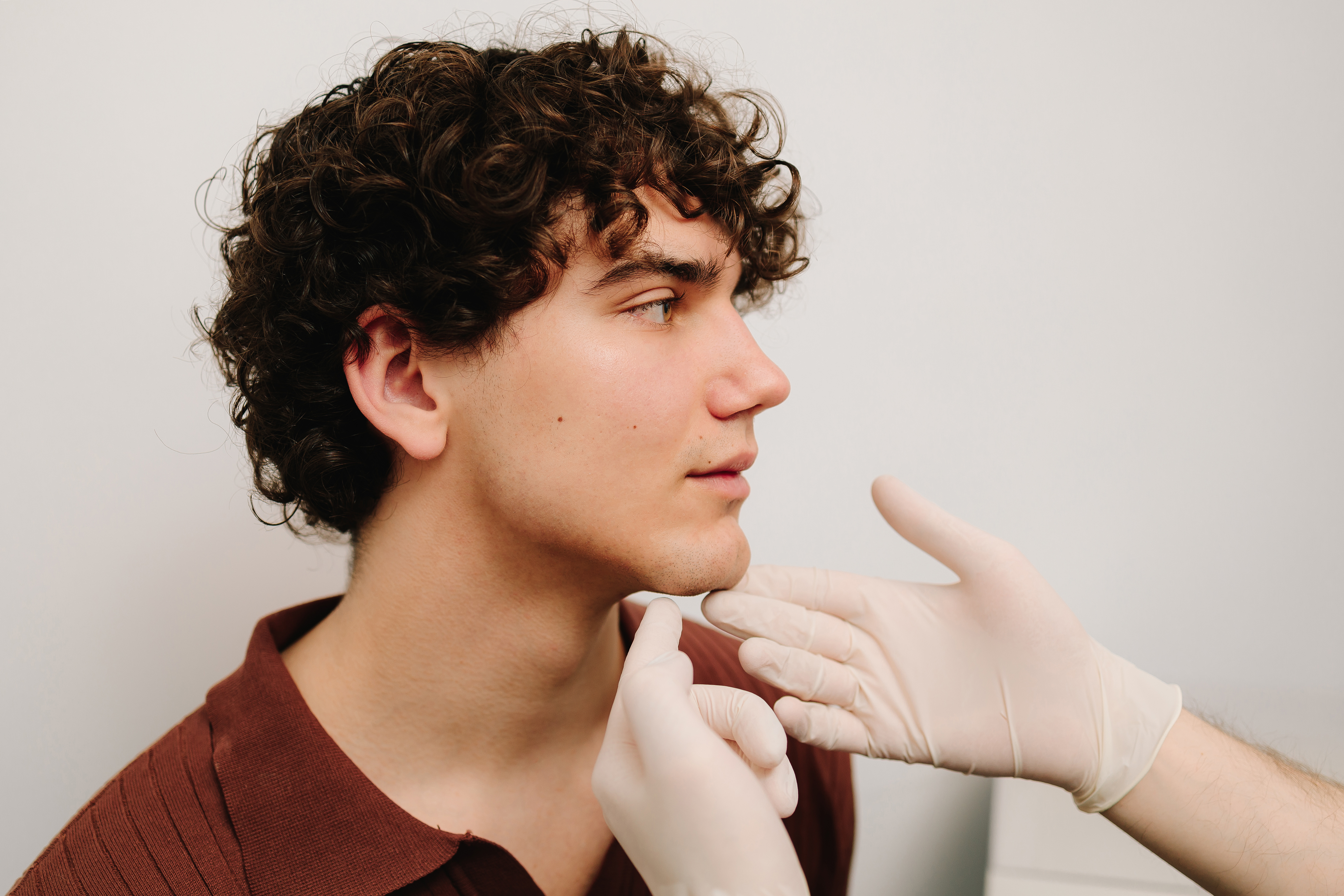 Man consulting for dermal fillers to enhance jawline and chin definition.