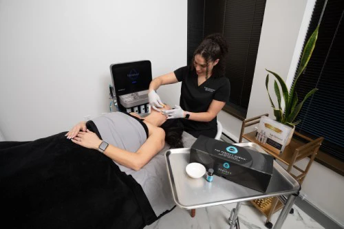 Aesthetician performing a chemical peels procedure on a client.